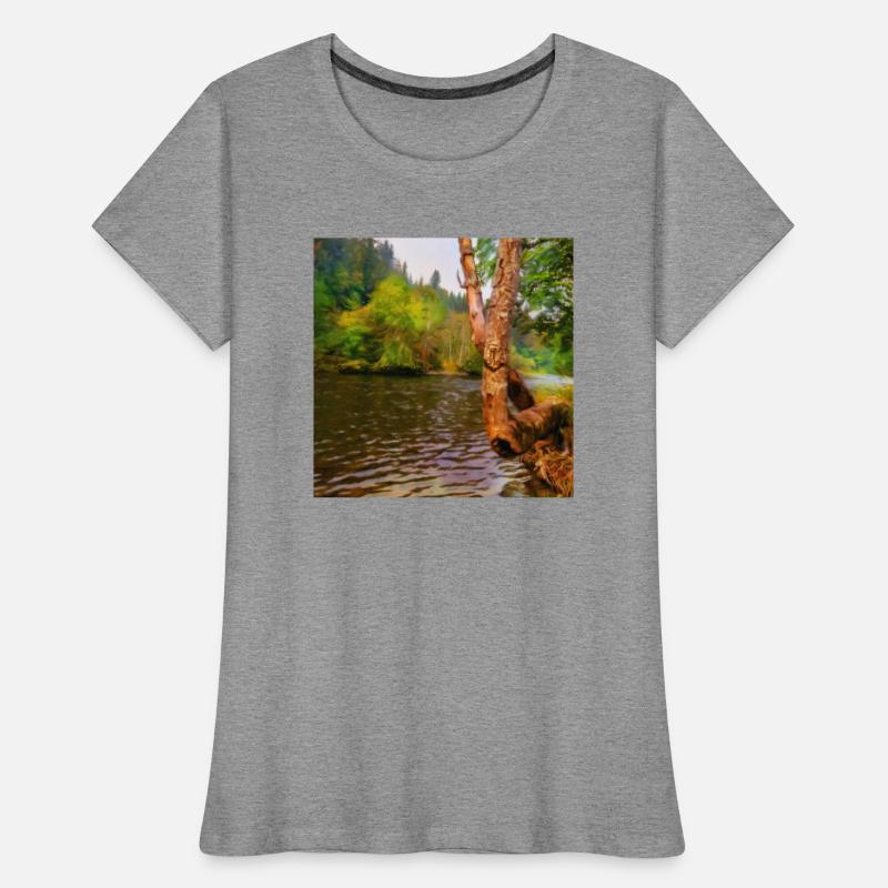 large tree growing over river bank